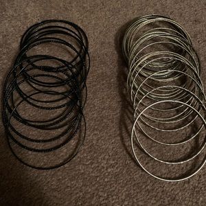 Costume jewelry, silver tone & black bangles